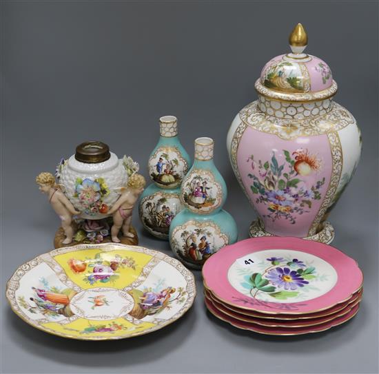 A Crown Dresden jar and cover, a pair of double gourd vases, a figural oil lamp, a Dresden plate and a set of four floral plates